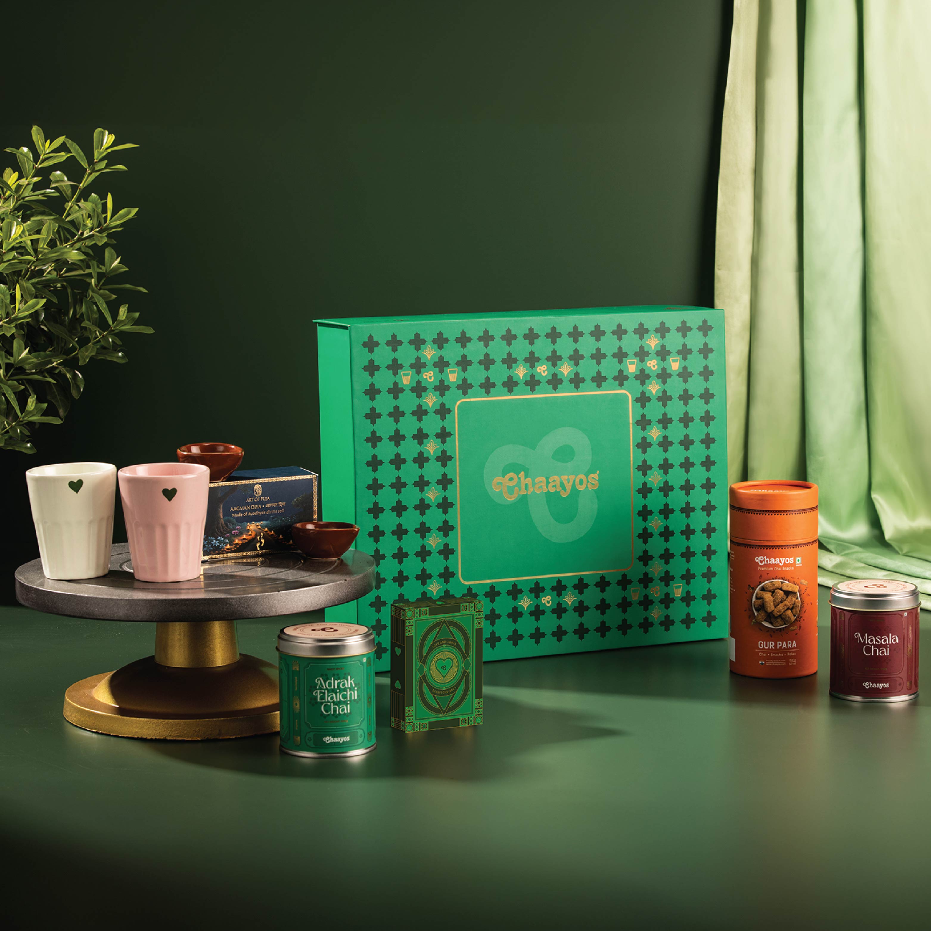 Chaayos Divine Diwali Gift Box | Diwali gift Hamper with that includes Chai tin (Masala chai & Adrak Elaichi), 2 Ceramic Kulhads (Pink & Green), Set of 2 Diyas, Diwali Playing Cards, Gur Para for Family & Friends | Premium Diwali Gift Set