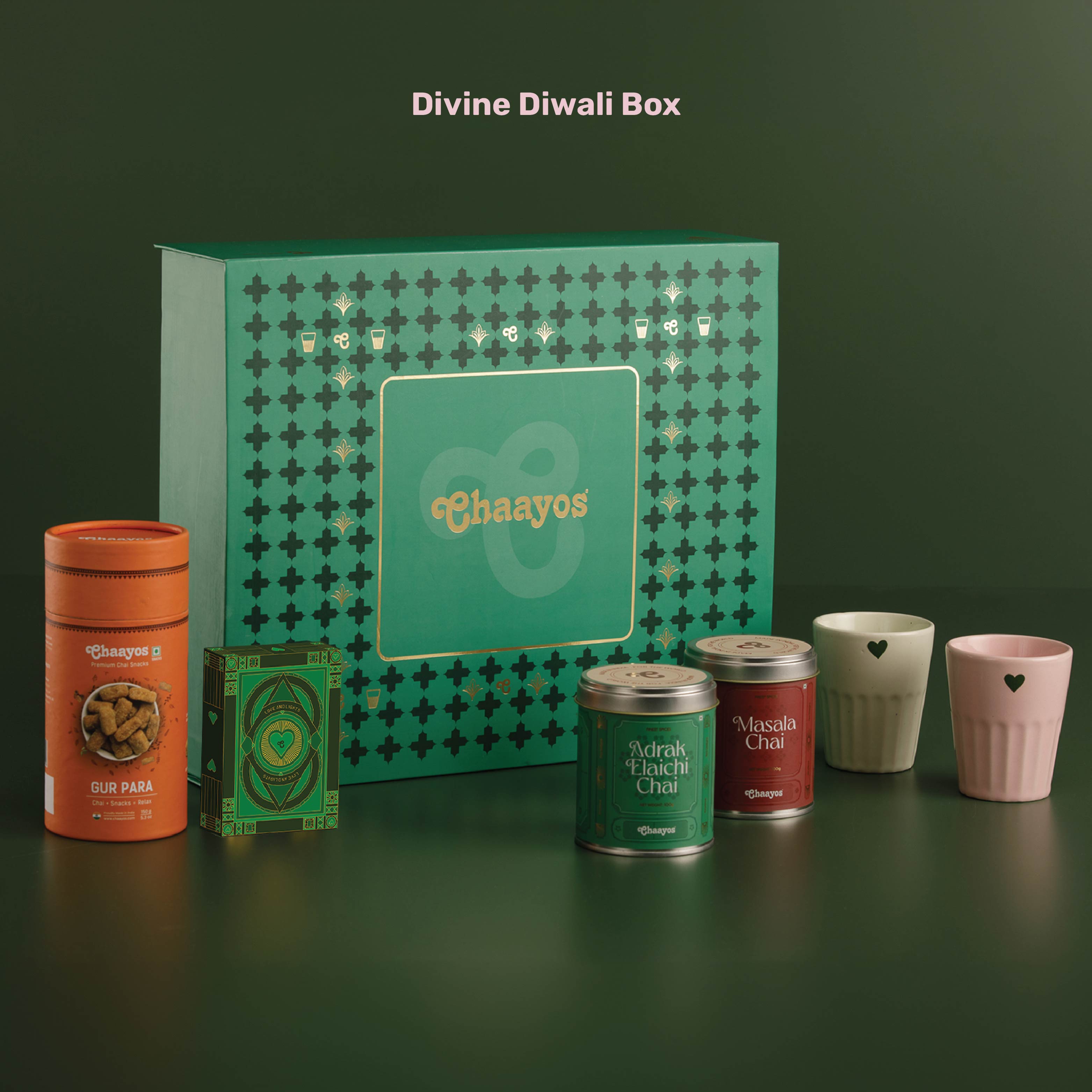 Chaayos Divine Diwali Gift Box | Diwali gift Hamper with that includes Chai tin (Masala chai & Adrak Elaichi), 2 Ceramic Kulhads (Pink & Green), Set of 2 Diyas, Diwali Playing Cards, Gur Para for Family & Friends | Premium Diwali Gift Set
